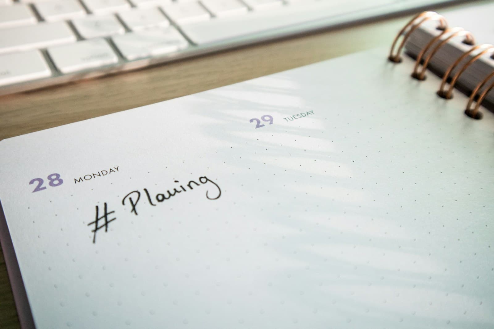 Editorial calendar planning notebook with planner and keyboard