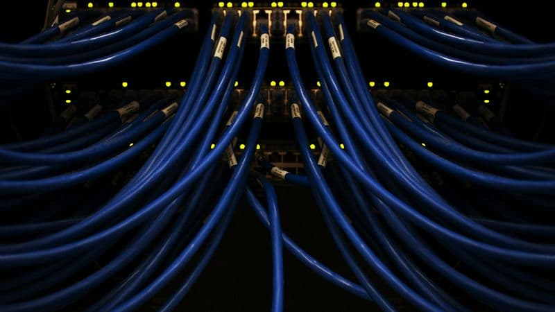 Blue network data cables connected in a data center
